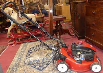 Lot 1151 - A Toro petrol driven lawn mower, with grass...