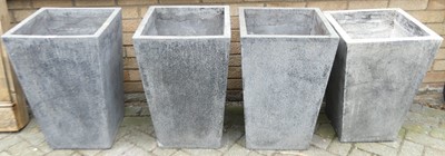 Lot 1396 - A set of four composite square tapering garden...