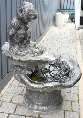 Lot 1402 - A reconstituted garden water feature, of shell...