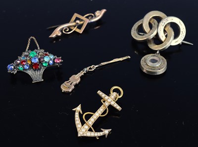 Lot 346 - A yellow metal bar brooch, with steel pin,...