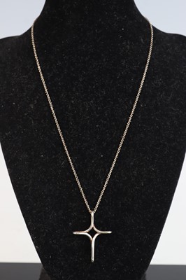 Lot 359 - A Tiffany & Co silver cross pendant, on...
