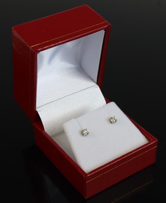Lot 361 - A pair of 18ct white gold diamond ear studs,...