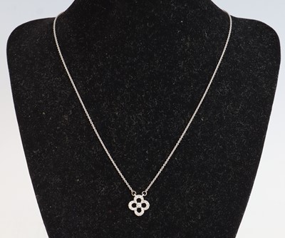 Lot 363 - A 9ct white gold diamond set quatrafoil style...