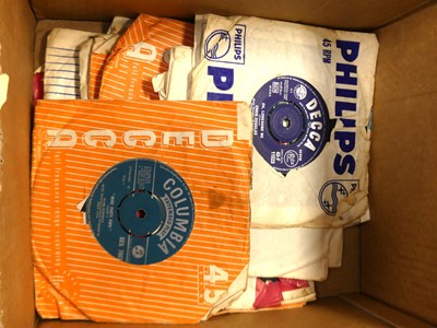Lot 665 - A collection of 45rpm records to include Let's...