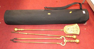 Lot 611 - A collection of brass fire tools, to include...