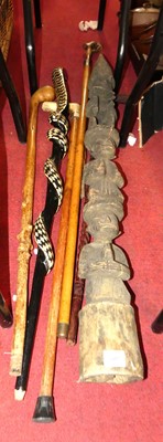 Lot 602 - A collection of walking canes and sticks, to...