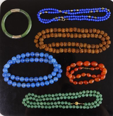 Lot 389 - A beaded and knotted jadeite necklace with...