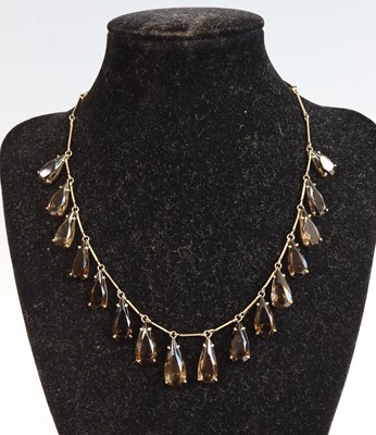 Lot 393 - A white metal smoky quartz set necklace...