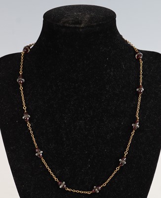 Lot 394 - A yellow metal cabochon garnet? and crystal...