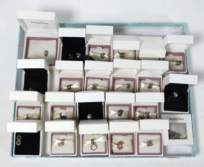 Lot 437 - A collection of Pandora bracelet charms, boxed