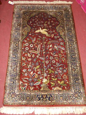 Lot 1129 - A Persian woollen red ground 'tree of life'...
