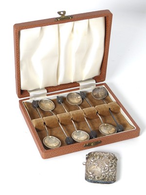 Lot 450 - A set of six silver coffee bean spoons,...
