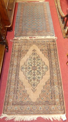 Lot 1134 - A Turkish woollen pale ground Anatolian rug,...