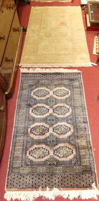 Lot 1135 - A Persian woollen peach and deep blue ground...