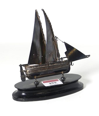 Lot 459 - A white metal model of a ship, mounted to an...