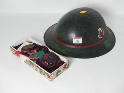 Lot 532 - A reproduction painted military helmet,...