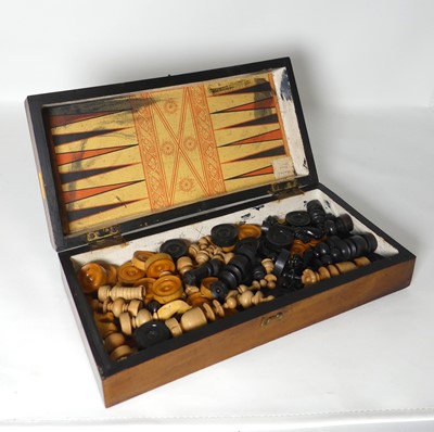 Lot 484 - A Victorian folding walnut chessboard, opening...