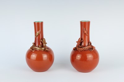 Lot 84 - A pair of Chinese coral-red bottle vases with...