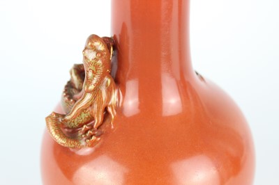 Lot 84 - A pair of Chinese coral-red bottle vases with...