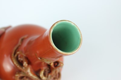 Lot 84 - A pair of Chinese coral-red bottle vases with...