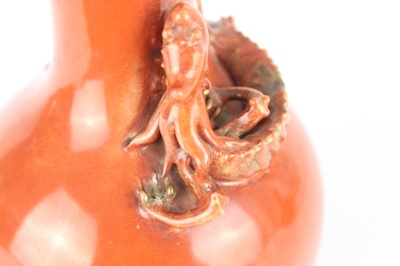 Lot 84 - A pair of Chinese coral-red bottle vases with...