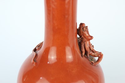 Lot 84 - A pair of Chinese coral-red bottle vases with...