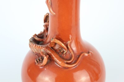 Lot 84 - A pair of Chinese coral-red bottle vases with...