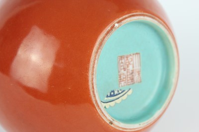 Lot 84 - A pair of Chinese coral-red bottle vases with...