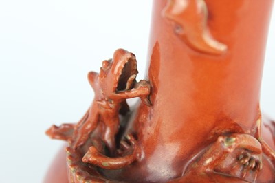 Lot 84 - A pair of Chinese coral-red bottle vases with...