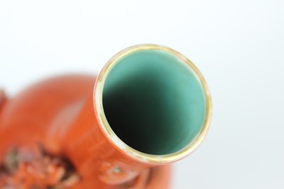 Lot 84 - A pair of Chinese coral-red bottle vases with...