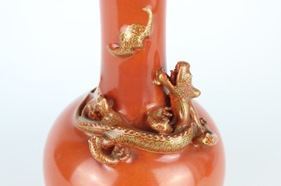 Lot 84 - A pair of Chinese coral-red bottle vases with...