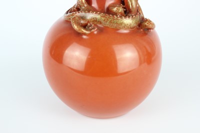 Lot 84 - A pair of Chinese coral-red bottle vases with...