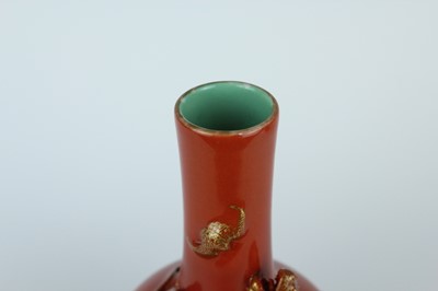 Lot 84 - A pair of Chinese coral-red bottle vases with...