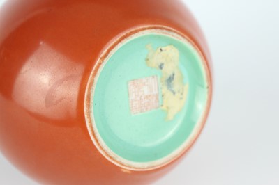 Lot 84 - A pair of Chinese coral-red bottle vases with...