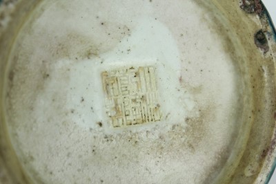 Lot 76 - A Chinese peacock-blue glazed jar with wood...