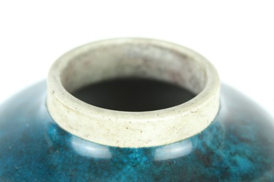 Lot 76 - A Chinese peacock-blue glazed jar with wood...
