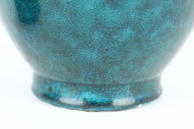Lot 76 - A Chinese peacock-blue glazed jar with wood...