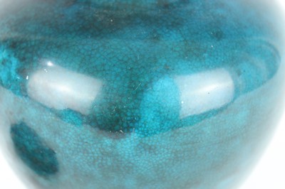 Lot 76 - A Chinese peacock-blue glazed jar with wood...