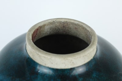 Lot 76 - A Chinese peacock-blue glazed jar with wood...