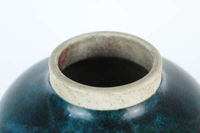 Lot 76 - A Chinese peacock-blue glazed jar with wood...