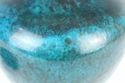 Lot 76 - A Chinese peacock-blue glazed jar with wood...