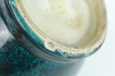 Lot 76 - A Chinese peacock-blue glazed jar with wood...