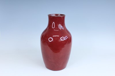 Lot 89 - A Chinese copper-red glazed baluster vase,...