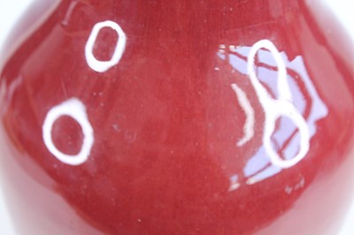 Lot 89 - A Chinese copper-red glazed baluster vase,...