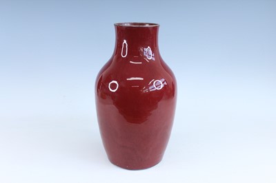 Lot 89 - A Chinese copper-red glazed baluster vase,...