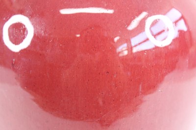 Lot 89 - A Chinese copper-red glazed baluster vase,...