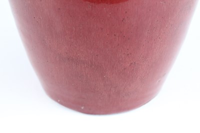 Lot 89 - A Chinese copper-red glazed baluster vase,...