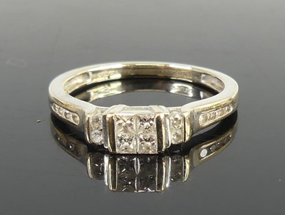 Lot 2694 - An 18ct white gold diamond dress ring, having...