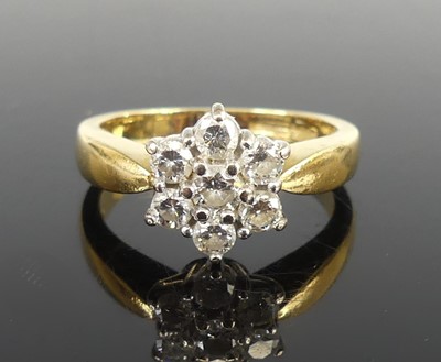 Lot 2695 - An 18ct yellow and white gold diamond flower...