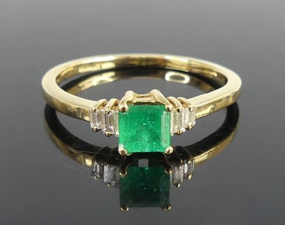 Lot 2697 - A yellow metal, emerald and diamond dress ring,...